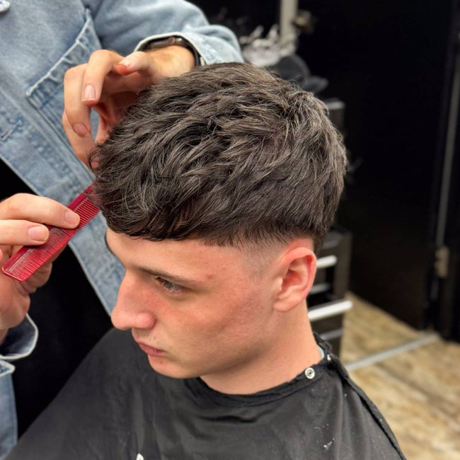 Hair being styled with wax